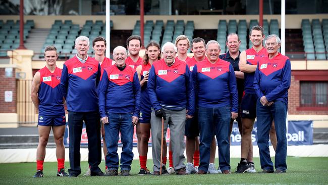 Past champions and present North Hobart players, from left, Thomas Reeves, Col Moore, Will Burgess, Des Graham, Michael Woods, Jacques Barwick, John Leedham, Josh Clifford, Robbie Devine, Trevor Best, Richard Robinson, Hugh Williams and David Collins don the club’s traditional guernsey. Picture: SAM ROSEWARNE