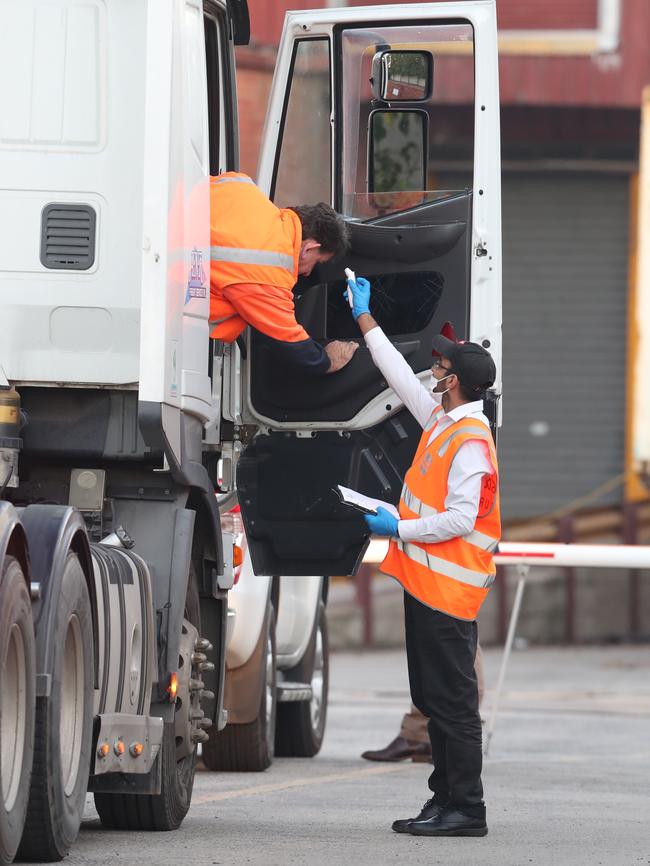 Strict protocols: Cedar Meats workers’ temperatures are checked on arrival at the abattoir. Picture: David Crosling