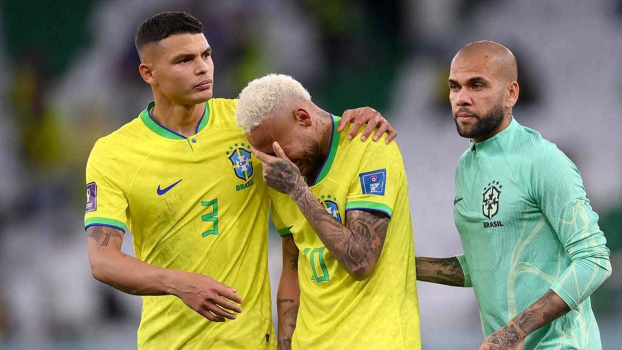 AL RAYYAN, QATAR - DECEMBER 09: Thiago Silva, Neymar and Dani Alves of Brazil look dejected after their sides' elimination from the tournament after a penalty shoot out loss during the FIFA World Cup Qatar 2022 quarter final match between Croatia and Brazil at Education City Stadium on December 09, 2022 in Al Rayyan, Qatar. (Photo by Laurence Griffiths/Getty Images)