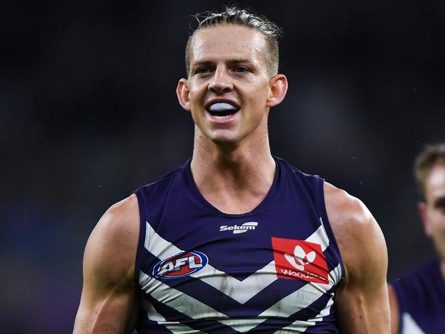 PERTH, AUSTRALIA - MAY 22: Nat Fyfe of the Dockers fronts up to Jordan Dawson of the Swans during the 2021 AFL Round 10 match between the Fremantle Dockers and the Sydney Swans at Optus Stadium on May 22, 2021 in Perth, Australia. (Photo by Daniel Carson/AFL Photos via Getty Images)