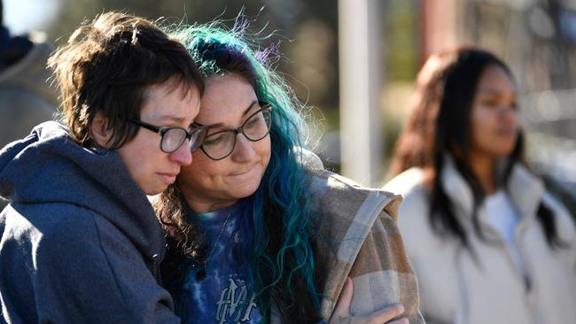 Jessy Smith Cruz embraces Jadzia Dax McClendon the morning after a mass shooting at Club Q, an LGBTQ nightclub in Colorado Springs. Picture: AFP