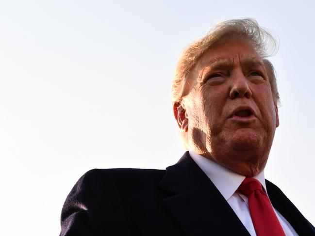 US President Donald Trump speaks with reporters before departing Indianapolis International Airport for a rally in Illinois on October 27, 2018 in Indianapolis, Indiana. (Photo by Nicholas Kamm / AFP)