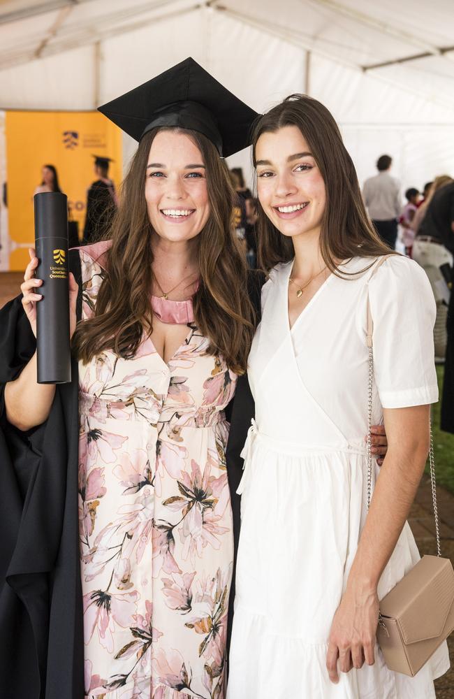 Master of Learning and Teaching graduate Alexandra Duro with sister Hannah Acutt at a UniSQ graduation ceremony at Empire Theatres, Tuesday, October 31, 2023. Picture: Kevin Farmer