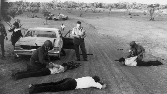 Police arrest Haley, Gunning and Brooks on the Birdsville Track in SA’s Far North. Photographer Ray Titus won a Walkley Award for his series of news pictures.