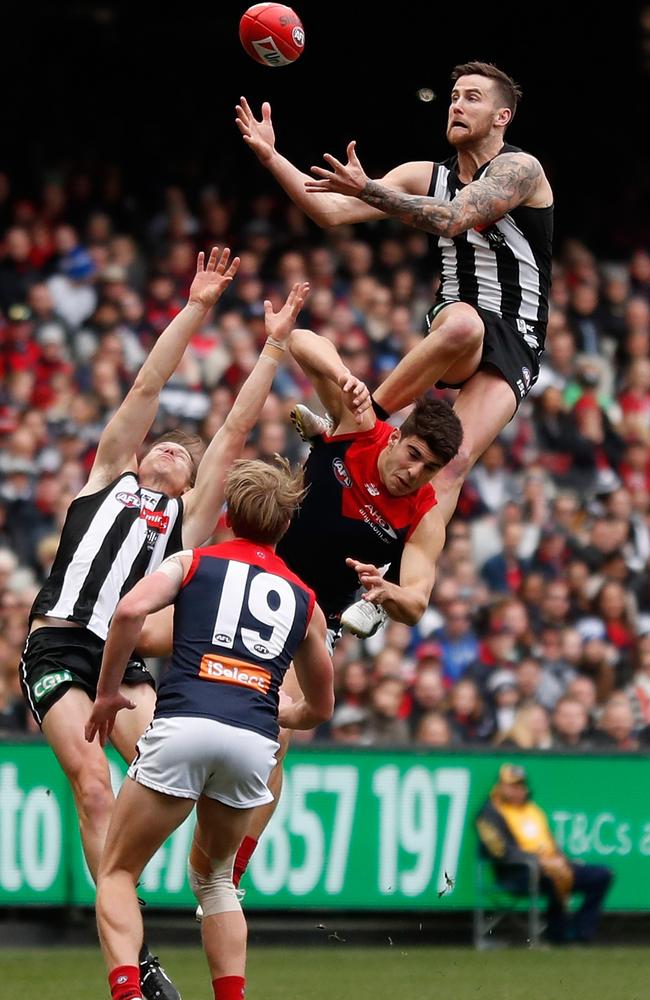 Jeremy Howe takes a spectacular mark over Christian Petracca.