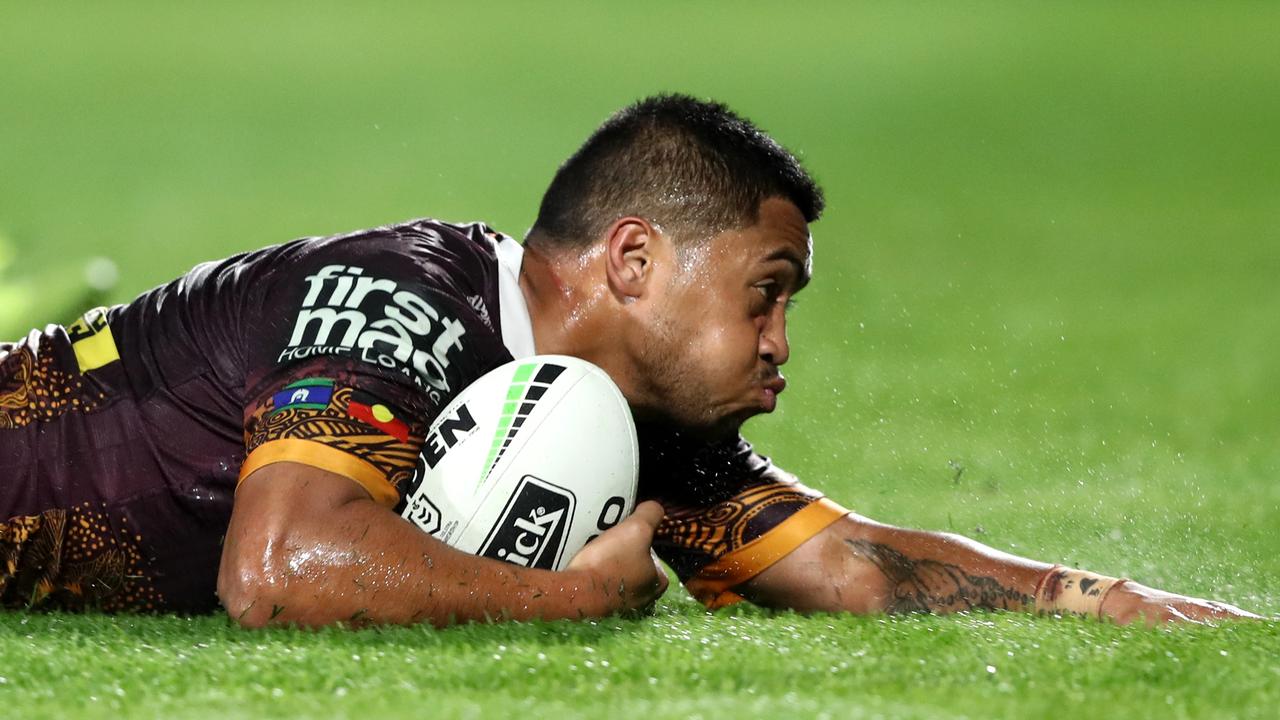 Anthony Milford of the Broncos dives over to score a try