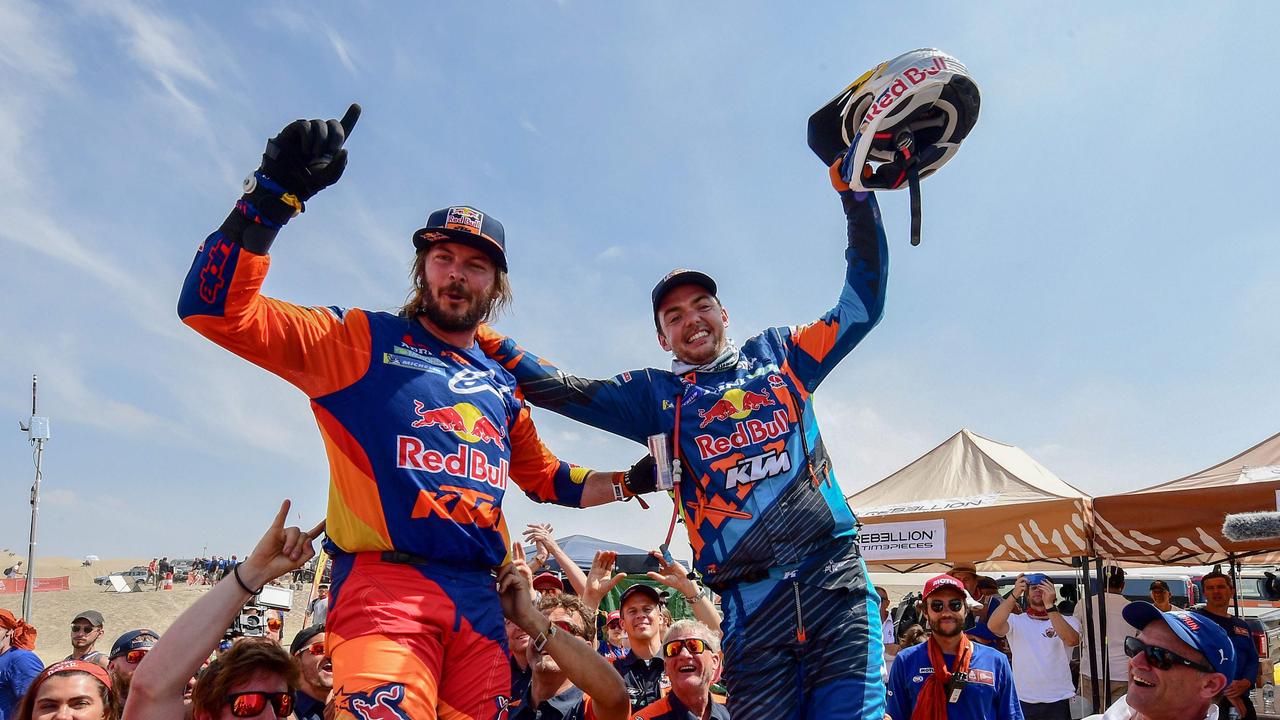 Toby Price (left) celebrates with KTM's Austrian biker Matthias Walkner after winning the Dakar Rally 2019. Picture: AFP