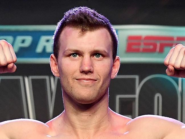 LAS VEGAS, NV - JUNE 08: WBO welterweight champion Jeff Horn poses on the scale as he makes weight on his second attempt during his official weigh-in at MGM Grand Garden Arena on June 8, 2018 in Las Vegas, Nevada. Horn will defend his title against Terence Crawford on June 9 at MGM Grand in Las Vegas.   Bradley Kanaris/Getty Images/AFP == FOR NEWSPAPERS, INTERNET, TELCOS & TELEVISION USE ONLY ==