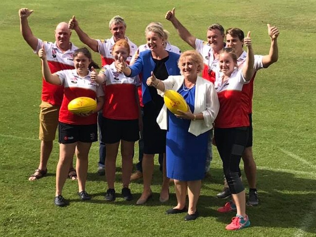 Bridget McKenzie with Coalition MP Michelle Landry and a sports team that received $146,200 in Yeppoon in her marginal seat.