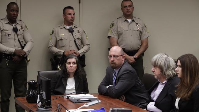 Louise Anna Turpin, left, with her lawyer Jeff Moore, and her husband David Allen Turpin, second from right, appears in court for their arraignment in Riverside, California. Picture: Gina Ferazzi/Los Angeles Times via AP, Pool