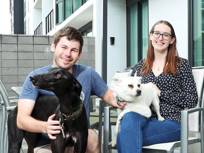 WEEKEND TELEGRAPHS SPECIAL. MUST TALK WITH PIC ED JEFF DARMANIN BEFORE PUBLISHING - Pictured is Ethan Rogers and Angelique Nisbet with their dogs Josie and Marcie at their courtyard unit in Edmondson Park today. Picture: Tim Hunter.