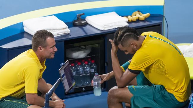 Nick Kyrgios of Australia with coach Lleyton Hewitt during his match against Roberto Bautista Agut of Spain during the semi-final on day 9 of the ATP Cup tennis tournament at Ken Rosewall Arena in Sydney, Saturday, January 11, 2020. (AAP Image/Craig Golding) NO ARCHIVING, EDITORIAL USE ONLY