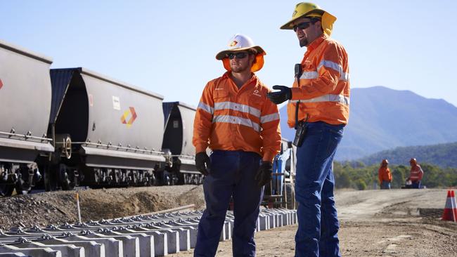 Aurizon workers laying tracks in central Queensland