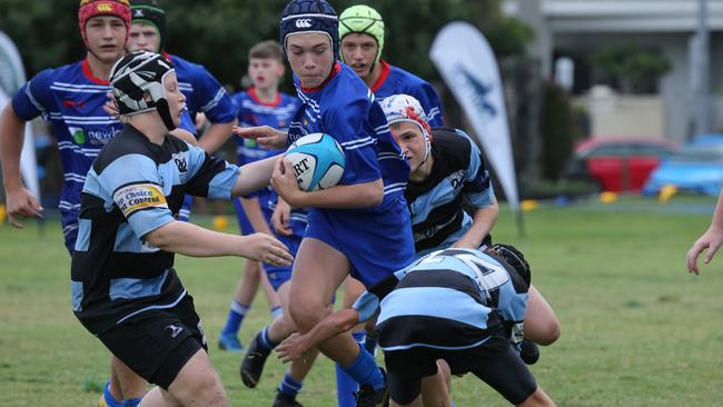 Day 1 of the King of the Country junior rugby union tournament at the Gold Coast Eagles Rugby Union Club.Maroochydore Swans (BLUE AND BLACK) vs USQ Saints (Blue ) Maroochydore Player No USQ Player No13 Artie Mc Millian Pic Mike Batterham