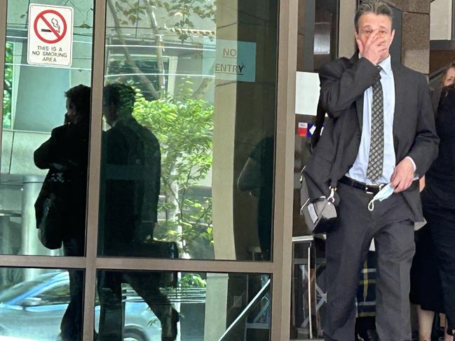 Chiropractor Ian Deitch, left, leaves Melbourne Magistrates' Court with his lawyer Simon Kenny, right, during a break in proceedings.