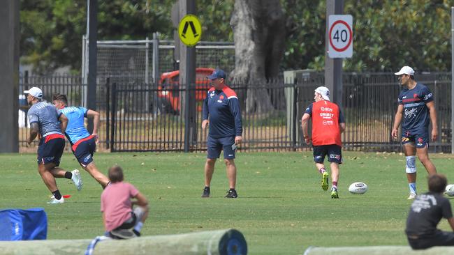 Billy Smith (right) looks on while coach Trent Robinson calls the shots. Photo: Simon Bullard