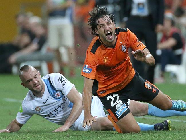 Ivan Franjic earns a yellow card for a crunching tackle on Thomas Broich. Picture: Jono Searle.