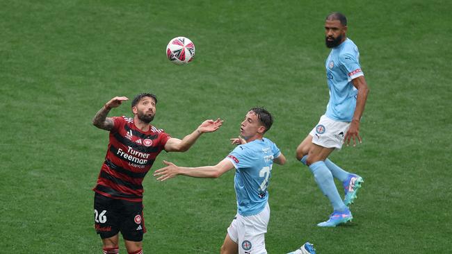 Brandon Borrello of Western Sydney Wanderers is challenged by Kai Trewin of Melbourne City during the round six A-League Men match between Melbourne City and Western Sydney Wanderers at AAMI Park, on November 30, 2024, in Melbourne, Australia. (Photo by Robert Cianflone/Getty Images)