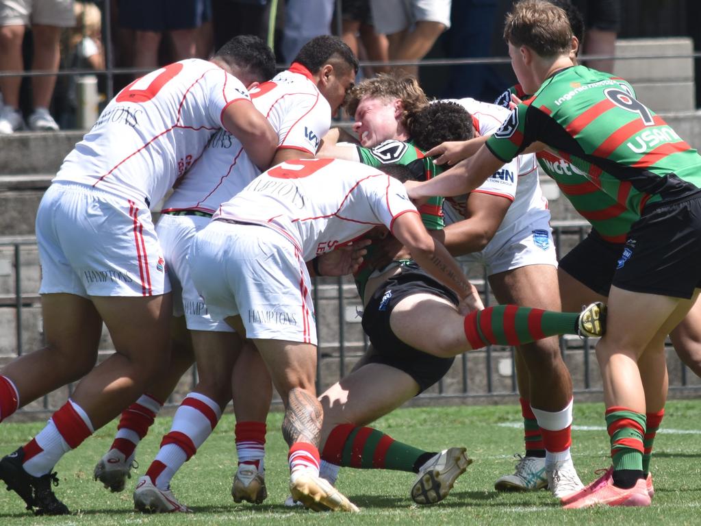 Johannes Logan is hit by a wall of defenders. Picture: Sean Teuma