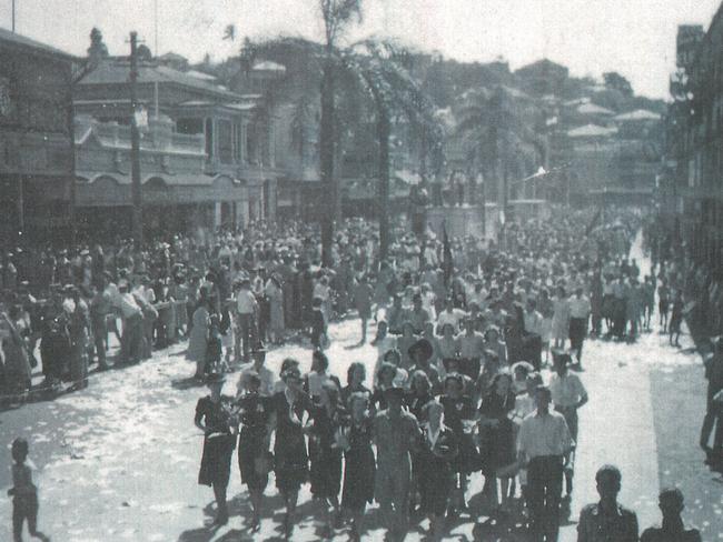 Workers march arm in arm down Flinders St after hearing news of Japan's surrender and the end of the war in the Pacific on August 15, 1945