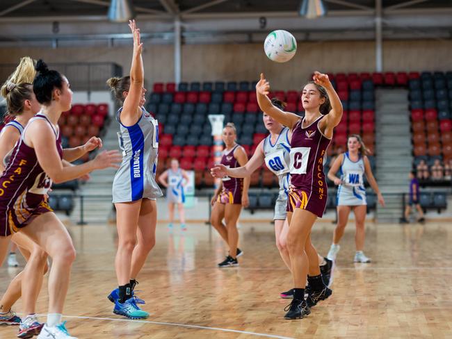 Round 5 Darwin Netball Premier League: Tracy Village Falcons v Banks Bulldogs at Territory Netball Stadium, Marrara. Lauren Pluker fires off a pass. Photograph: Che Chorley