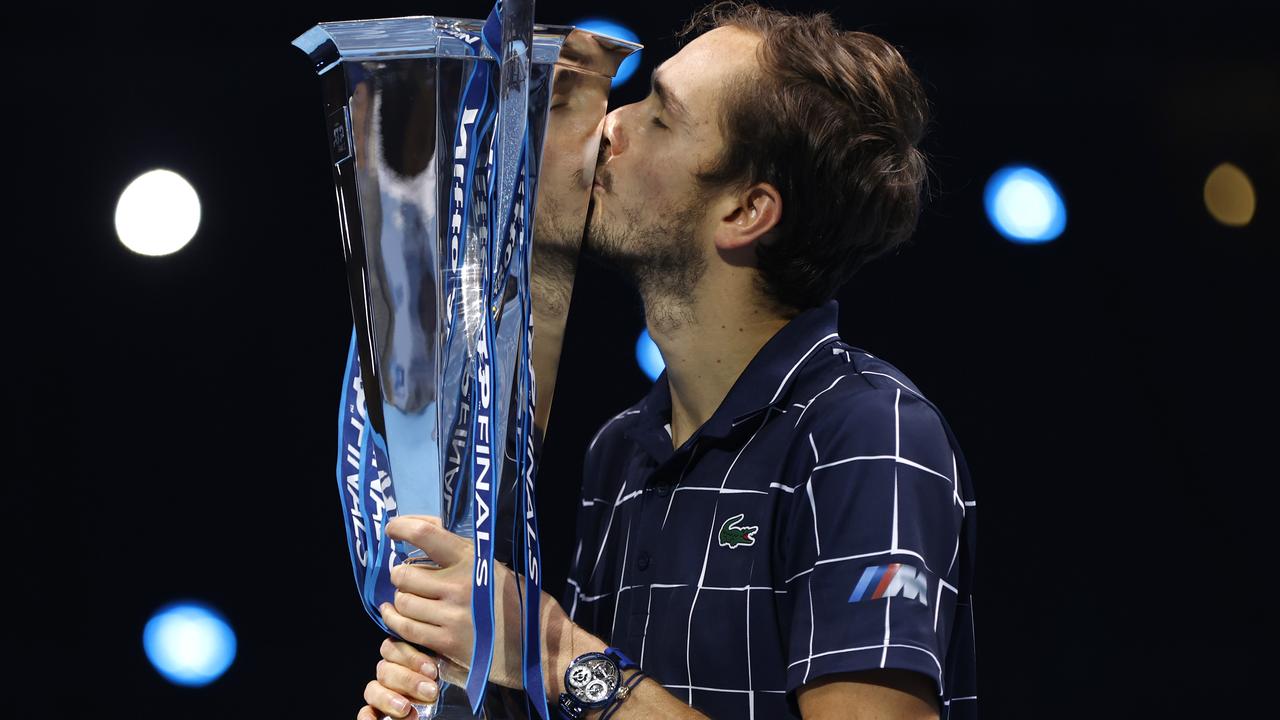 Daniil Medvedev of Russia lifts the trophy.