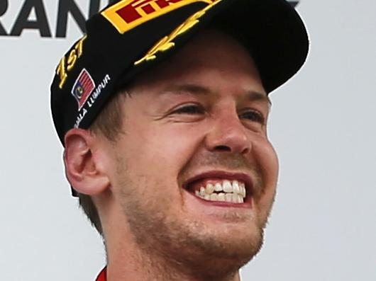 FILE - In this Sunday, March 29, 2015 file photo, Ferrari driver Sebastian Vettel, center, of Germany celebrates as he stands with Mercedes drivers Nico Rosberg, right, of Germany who placed third, and Lewis Hamilton of Britain, who placed second, on the podium after winning the Malaysian Formula One Grand Prix at Sepang International Circuit in Sepang, Malaysia. As the Formula One circuit heads to Shanghai for the Chinese Grand Prix, it's no longer a safe bet that Mercedes will top the podium by the end of the weekend. (AP Photo/Vincent Thian, File)