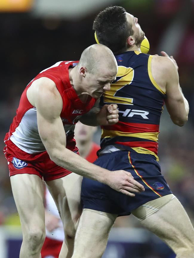 Zak Jones crunches Brad Crouch. Picture: Sarah Reed