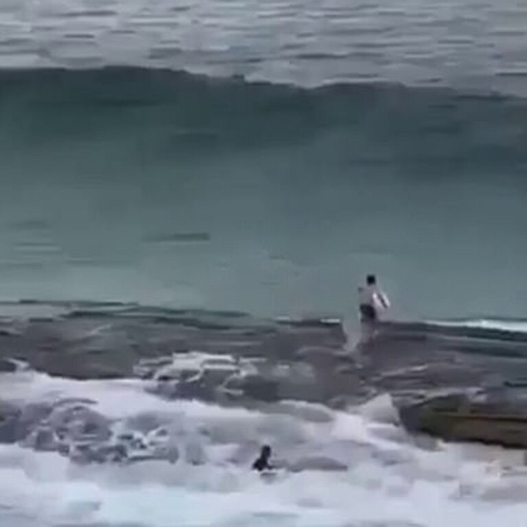 This is the moment one of the surfers jumps from the rocks and into the huge wave at Mackenzie’s Bay. Picture: Instagram / Bill Morris