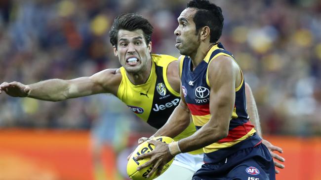 Eddie Betts runs past Alex Rance. Picture: Sarah Reed