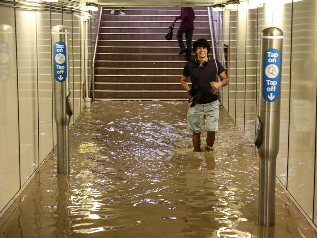 Commuters struggle against torrential rain and gale force winds in Lewisham as Sydney is lashed with a monumental early summer storm, 28/11/18. Picture: Nicholas Eagar