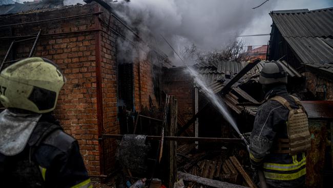 Firefighters extinguish a fire in a residential area of Bakhmut, Donetsk region amid the Russian invasion of Ukraine.