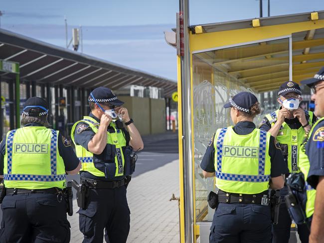 Tasmania Police officers at Hobart airport during the COVID-19 lockdown last March. Picture: Chris Kidd