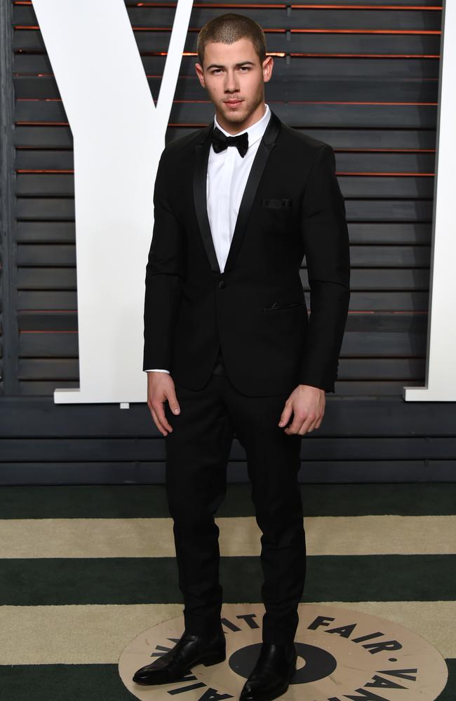 Nick Jonas arrives at the Vanity Fair Oscar Party on Sunday, Feb. 28, 2016, in Beverly Hills, Calif. (Photo by Evan Agostini/Invision/AP)