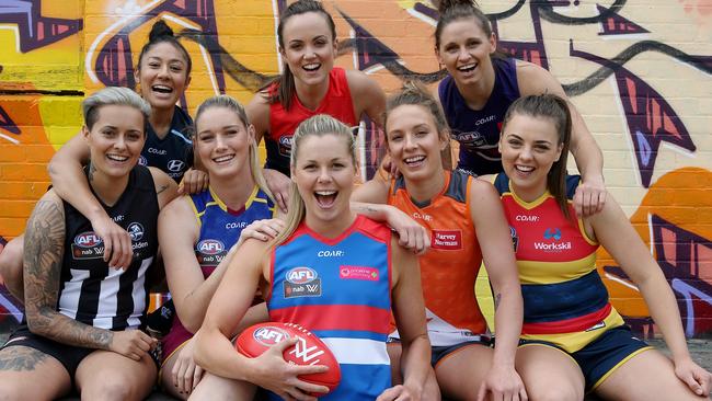 AFL Women's players parade next season's jumpers. (from left) Moana Hope, Darcy Vescio, Tayla Harris, Daisy Pearce, Katie Brennan, Emma Swanson, Kara Donnellan and Ebony Marinoff. Picture: Wayne Ludbey