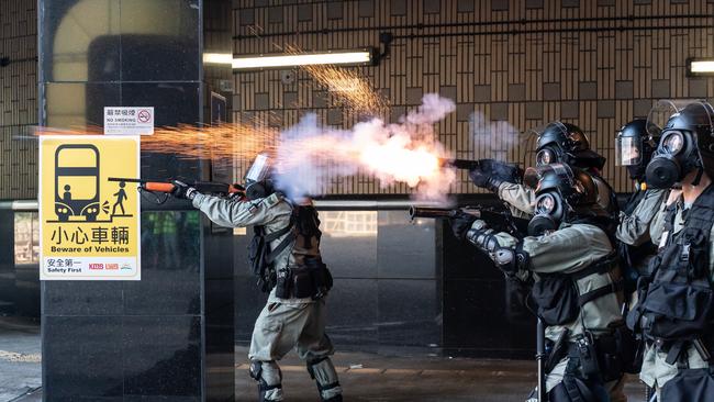 Riot police fire teargas and rubber bullets as protesters attempt to leave The Hong Kong Poytechnic University on Monday. Picture: Getty Images