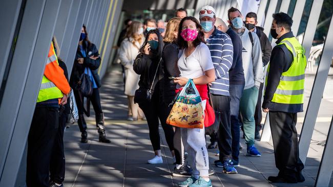 People queue to be vaccinated at the Melbourne Exhibition Centre. Picture: Jake Nowakowski