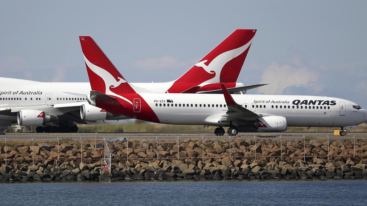 Qantas estimates reduced travel due to coronavirus will slice between $100 million and $150 million from its earnings this year. Picture: AP Photo/Rick Rycroft, File.