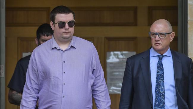 Corey Johnston next to his lawyer Michael Woods leaving Adelaide Magistrates Court in January. Picture: Roy VanDerVegt