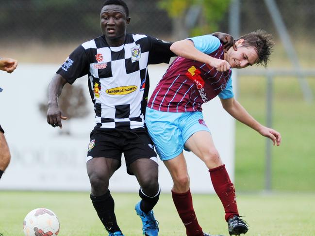 Jacob Gittens of Port Darwin battles for the ball. Picture: Elise Derwin