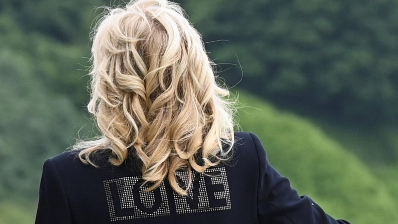 Dr Jill Biden wore a jacket emblazoned with the word ‘love’ that has been seen as a dig at former FLOTUS Melania Trump. Picture: Toby Melville-WPA Pool/Getty Images