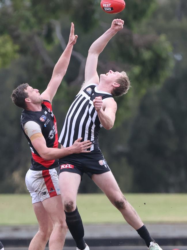 Port Adelaide ruckman Sam Hayes jumps high to win the tap in the Magpies’ loss to West Adelaide. Picture: SANFL / David Mariuz