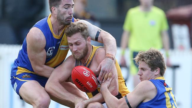 Box Hill’s Jonathan O'Rourke is gang tackled. Picture: Michael Klein