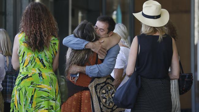 Members of Theo Hayez' family embraced community volunteer search party members, outside Byron Bay Court House on the tenth day of the inquest into Theo's 2019 disappearance on Friday. Picture: Liana Boss