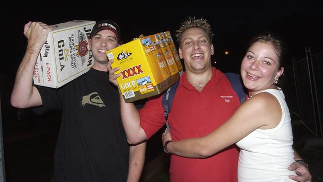 Luke Sorensen, Ryan Oliver and Christie Sirl of Morayfield celebrate New Year’s Eve at Mooloolaba in 2003. Picture: Barry Leddicoat.