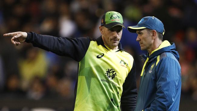 Aaron Finch with Australia coach Justin Langer. Picture: AAP