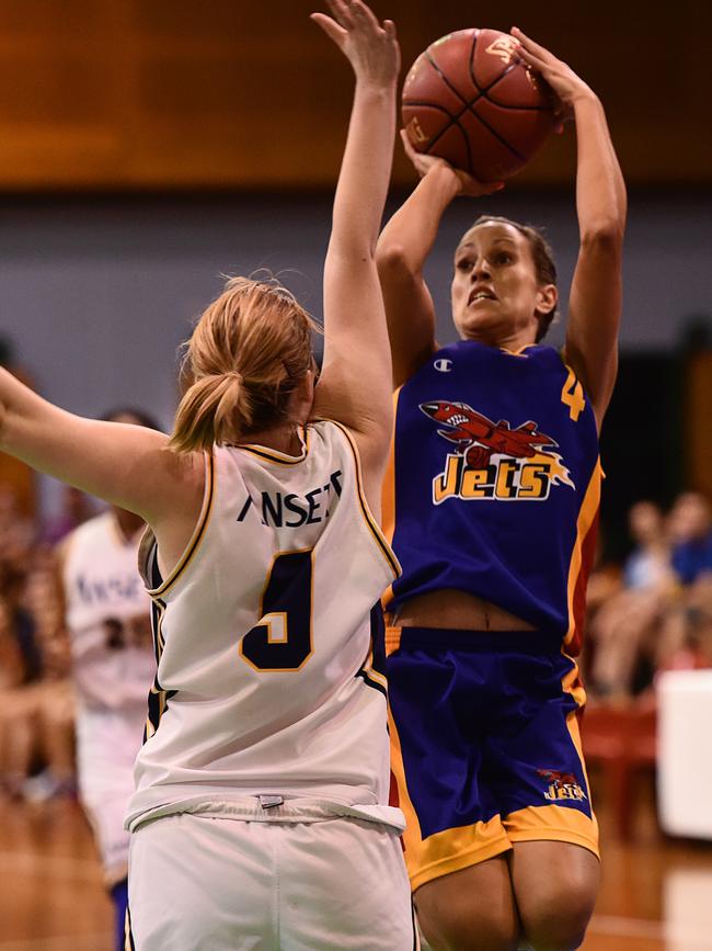 Jets’ Kylie Duggan goes up for a shot in the DBA Grand Final against Ansett in December, 2015. Defending her is Ansett’s Isabella Politis. Picture: HELEN ORR