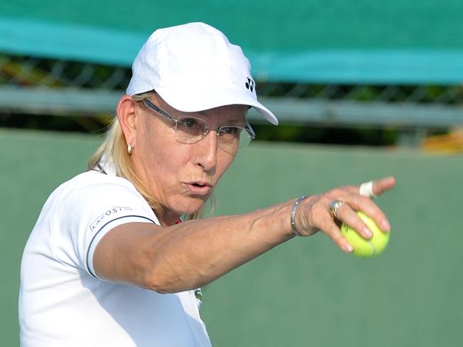 (FILES) This file photo taken on November 26, 2015 shows former US tennis player Martina Navratilova taking part in a mixed doubles exhibition match during the Tennis Masters Hyderabad 2015 at the Sania Mirza Tennis Academy (SMTA) in Hyderabad. Navratilova slammed "sick and dangerous" comments by Australia's Margaret Court that the sport was "full of lesbians" and transgender child were the result of a Nazi-style plot. / AFP PHOTO / NOAH SEELAM