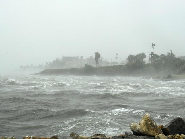Strong winds batter seaside houses on the Texas coast. Picture: AFP / Marlk Ralston