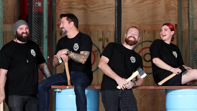 Rory Swane, Scott McAndrew, Sam Hay and Jess Layne at Lumber Punks Axe-Throwing in West End. Picture: Tara Croser